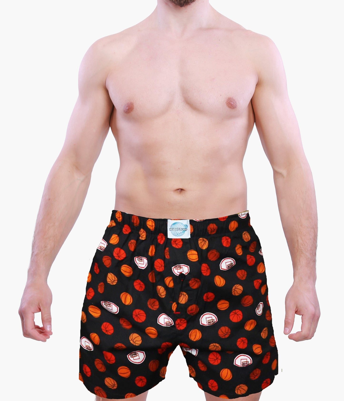 Man wearing black boxer shorts with red and orange basketball graphics on a white background