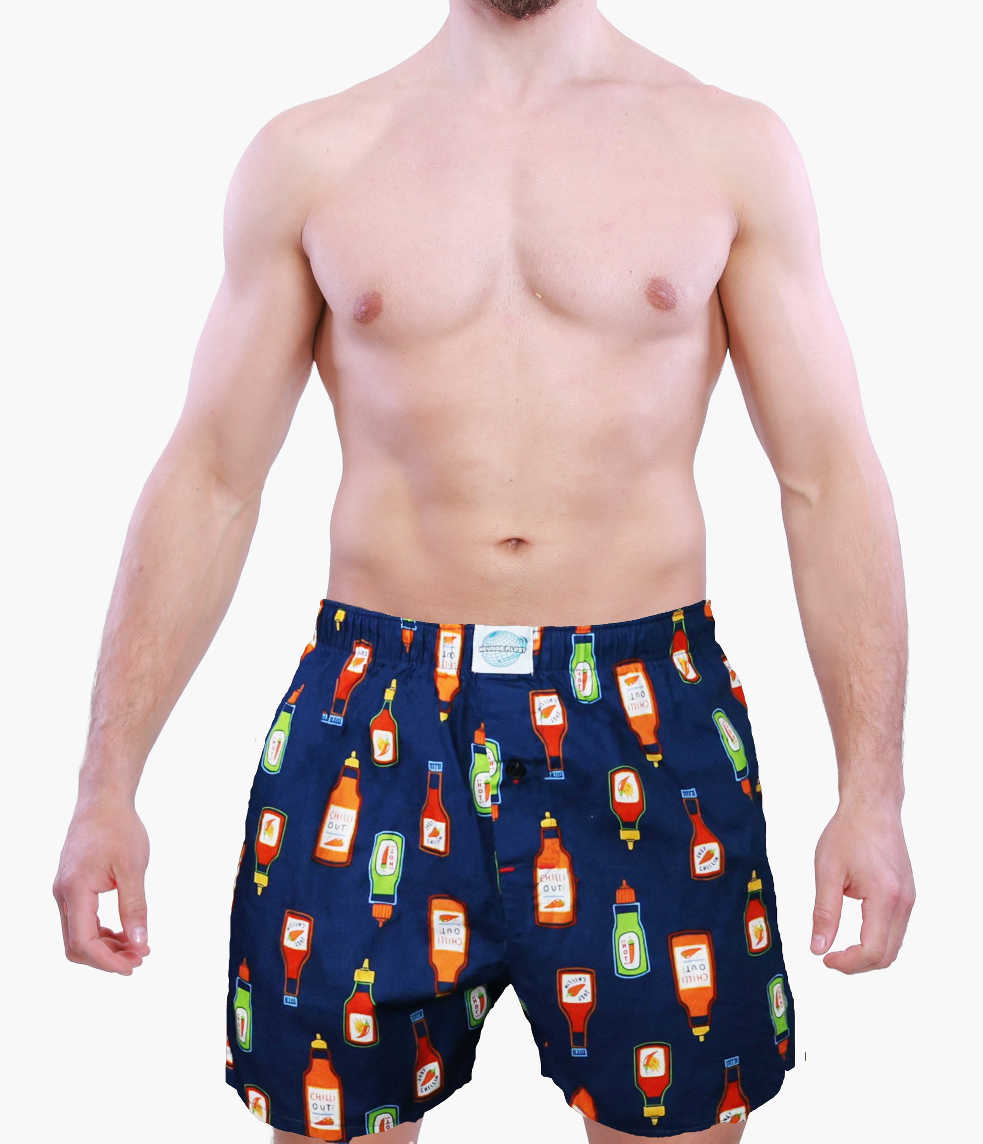 Man wearing Weunderlust Navy blue boxer shorts  with hot sauce bottle pattern on a white background