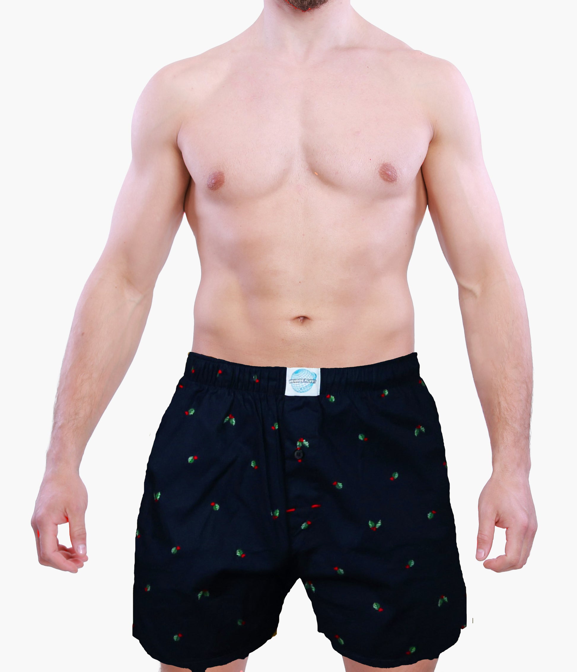 Man wearing black boxer shorts with a small pattern on a white background
