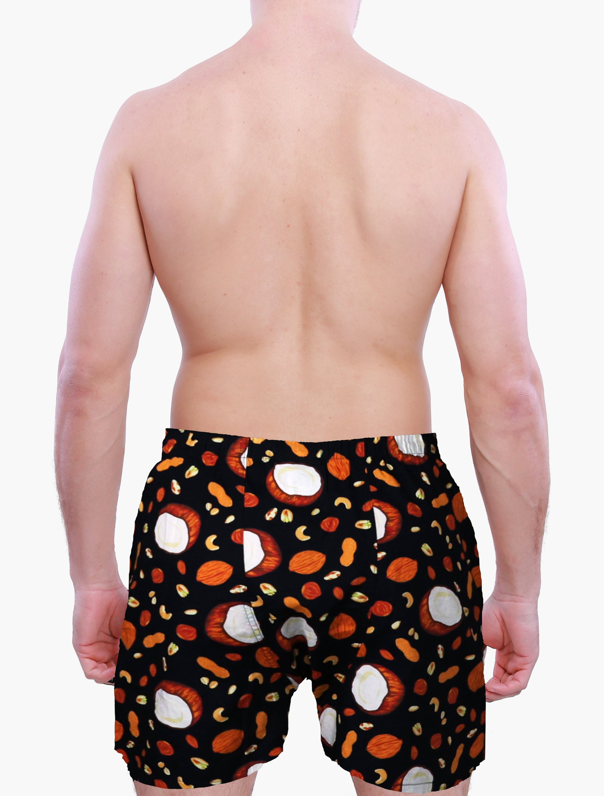 Back side of a person wearing Weunderlust boxer Shorts with a pattern of coconut and nuts on a white background