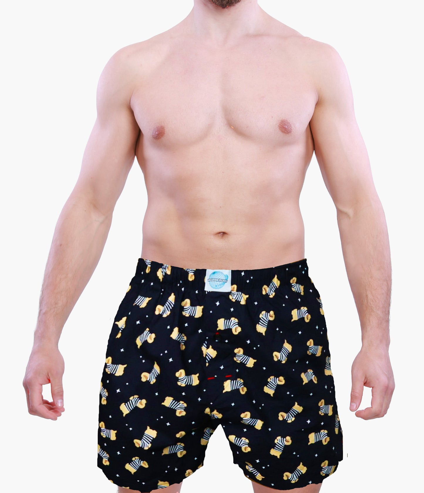 Man wearing black boxer shorts with yellow dog pattern on a white background