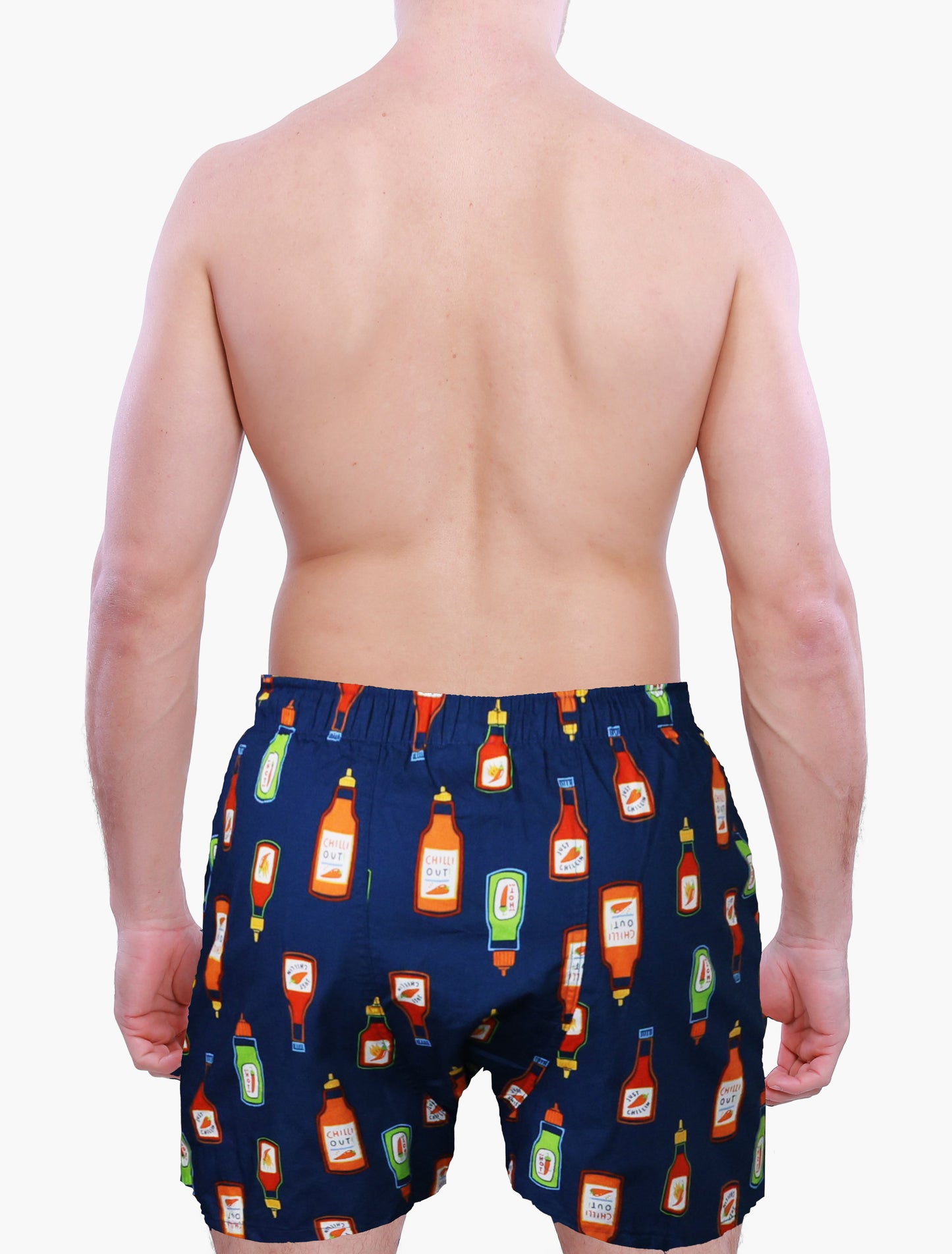 back side of a male model wearing Weunderlust Navy blue boxer shorts  with hot sauce bottle pattern on a white background